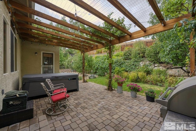 159 River Flow Dr, Reno, NV 89523 - view of patio / terrace with a hot tub, a pergola, grilling area, and fence