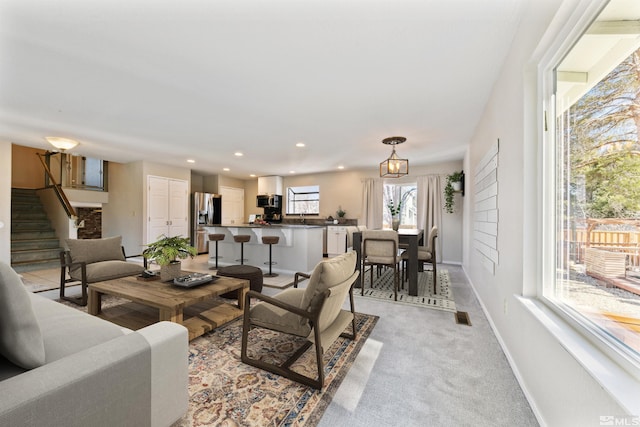 1599 Lucerne, Minden, NV 89423 - living area with baseboards, stairway, recessed lighting, and light carpet
