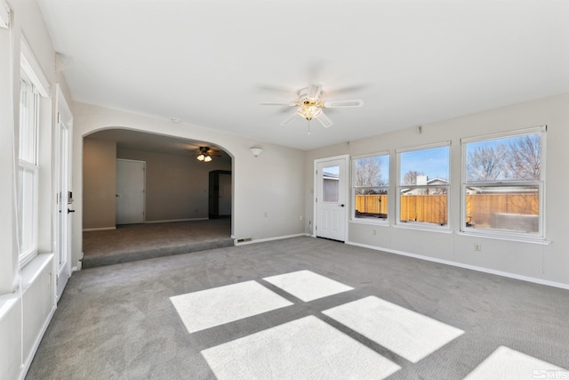 1599 Lucerne, Minden, NV 89423 - carpeted empty room with arched walkways, a ceiling fan, and baseboards