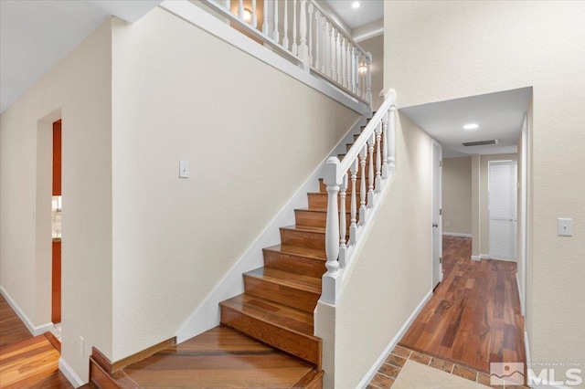 4550 Noche Ln, Reno, NV 89502 - stairway with baseboards and wood finished floors