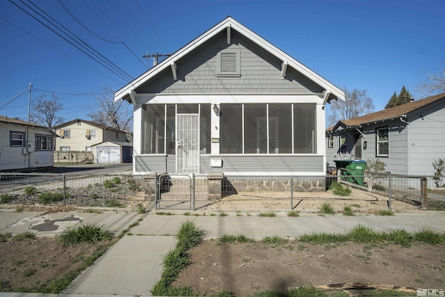 529 11th St, Sparks, NV 89431 - view of front of house with a sunroom, a gate, and a fenced front yard