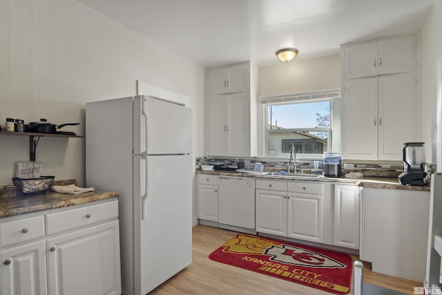 529 11th St, Sparks, NV 89431 - kitchen featuring white appliances, a sink, white cabinets, and light wood-type flooring