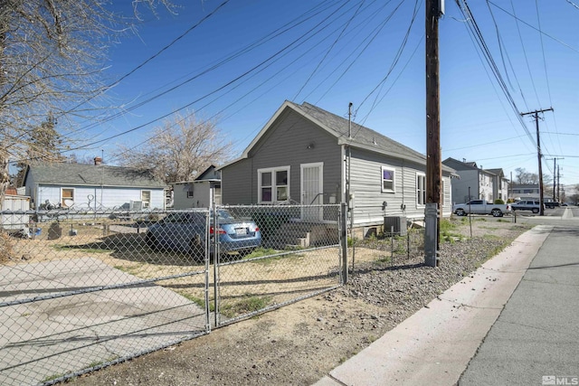 529 11th St, Sparks, NV 89431 - view of front of house with a fenced front yard, a gate, and central AC
