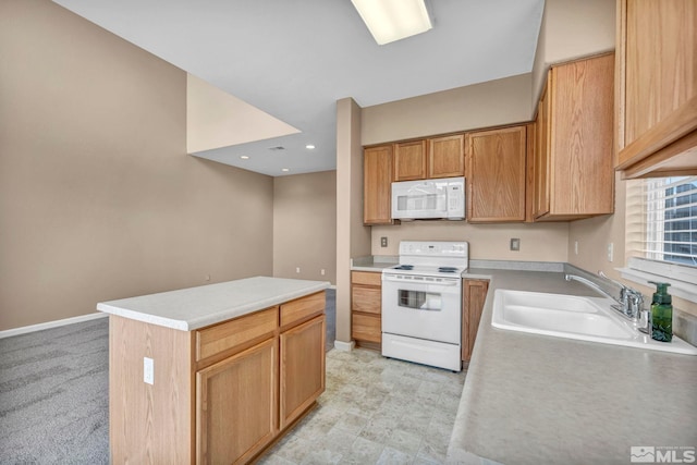 9195 Brown Eagle Ct, Reno, NV 89506 - kitchen with white appliances, a sink, a kitchen island, and light countertops