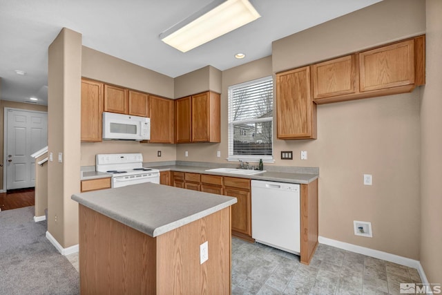 9195 Brown Eagle Ct, Reno, NV 89506 - kitchen featuring white appliances, a sink, baseboards, light countertops, and recessed lighting