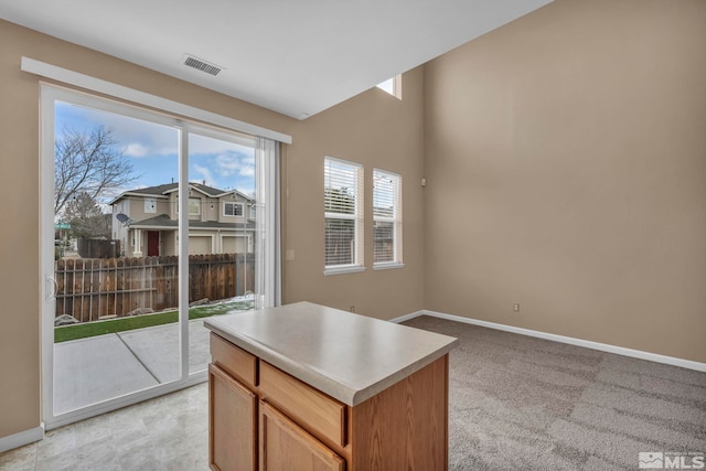 9195 Brown Eagle Ct, Reno, NV 89506 - spare room featuring baseboards, light carpet, and lofted ceiling
