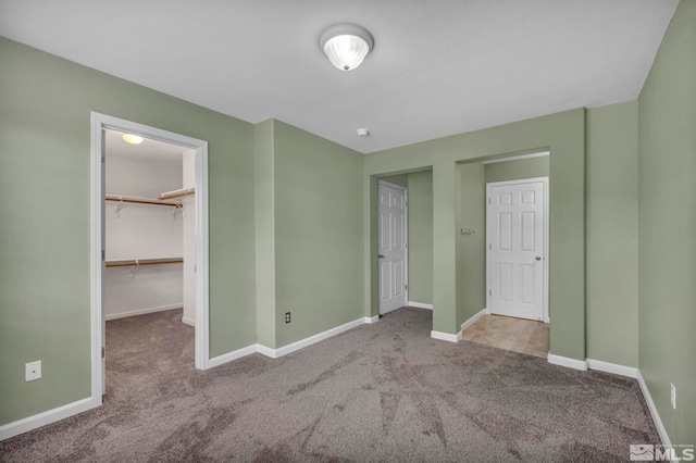 9195 Brown Eagle Ct, Reno, NV 89506 - unfurnished bedroom with carpet flooring, a spacious closet, and baseboards