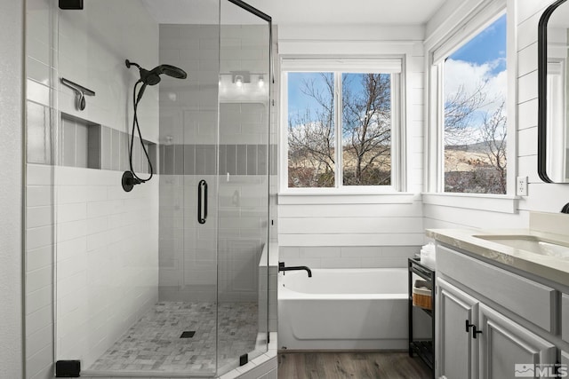 5895 Tappan Dr, Reno, NV 89523 - full bathroom with a stall shower, vanity, wood finished floors, and a garden tub