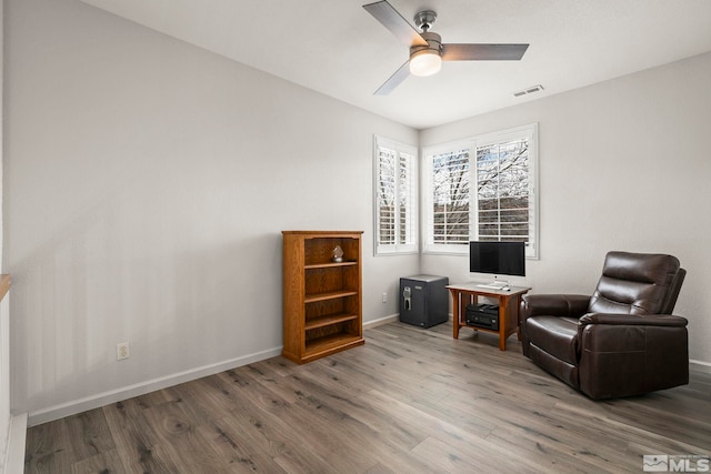 5895 Tappan Dr, Reno, NV 89523 - living area with wood finished floors, baseboards, and ceiling fan