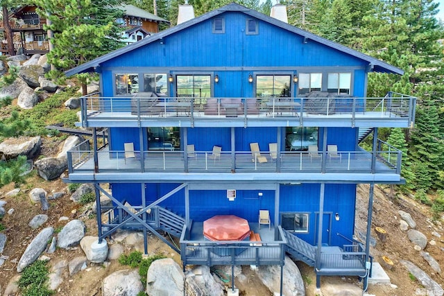 243 Tramway Dr, Stateline, NV 89449 - rear view of property featuring a balcony and a chimney