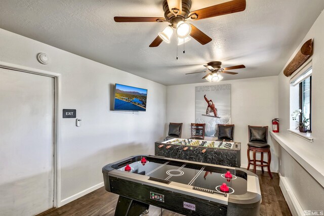 243 Tramway Dr, Stateline, NV 89449 - recreation room featuring dark wood-style flooring, baseboards, and a ceiling fan