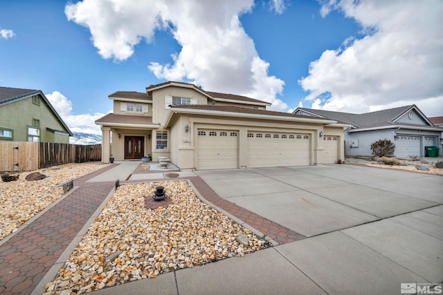 2861 Sunline Dr, Reno, NV 89523 - view of front of house with fence, stucco siding, concrete driveway, and a garage