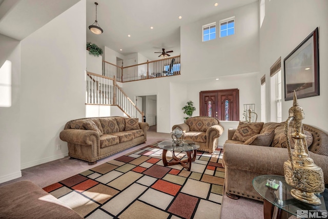 2861 Sunline Dr, Reno, NV 89523 - living room featuring a high ceiling, stairway, light colored carpet, a ceiling fan, and recessed lighting