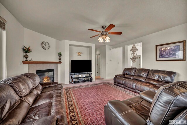 2861 Sunline Dr, Reno, NV 89523 - living room with a ceiling fan, a tiled fireplace, and baseboards