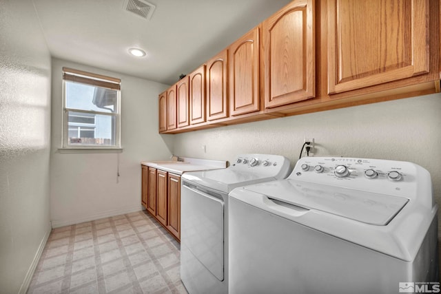 2861 Sunline Dr, Reno, NV 89523 - laundry room featuring light floors, separate washer and dryer, cabinet space, and baseboards