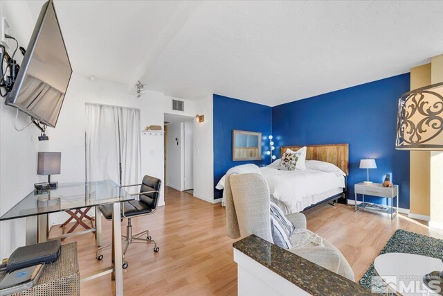 280 Island Ave Unit 607, Reno, NV 89501 - bedroom with light wood-type flooring and baseboards