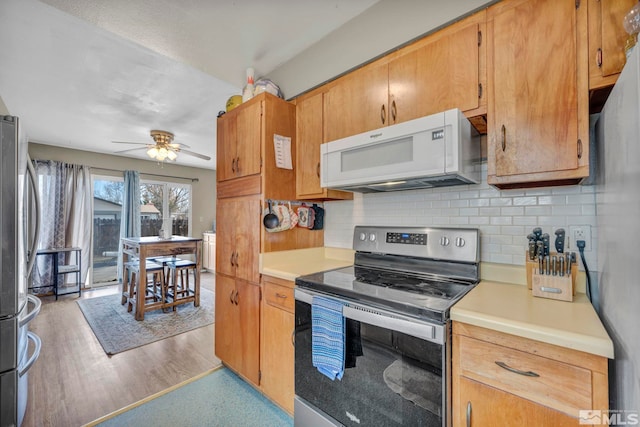 435 Cindy, Fallon, NV 89406 - kitchen featuring appliances with stainless steel finishes, tasteful backsplash, light countertops, and ceiling fan