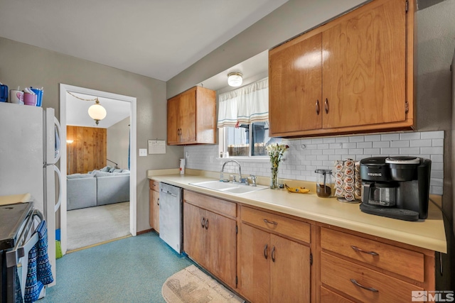 435 Cindy, Fallon, NV 89406 - kitchen featuring dishwasher, a sink, range with electric cooktop, backsplash, and light countertops
