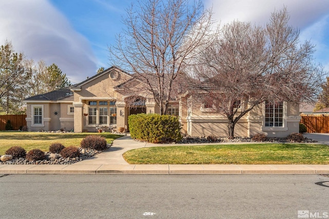 7972 Tres Arroyos Dr, Sparks, NV 89436 - traditional-style house featuring stucco siding