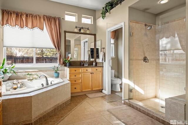 7972 Tres Arroyos Dr, Sparks, NV 89436 - bathroom with a shower stall, a garden tub, tile patterned floors, vanity, and toilet