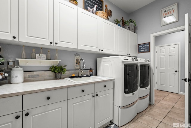 7972 Tres Arroyos Dr, Sparks, NV 89436 - laundry room featuring separate washer and dryer, cabinet space, and light tile patterned floors