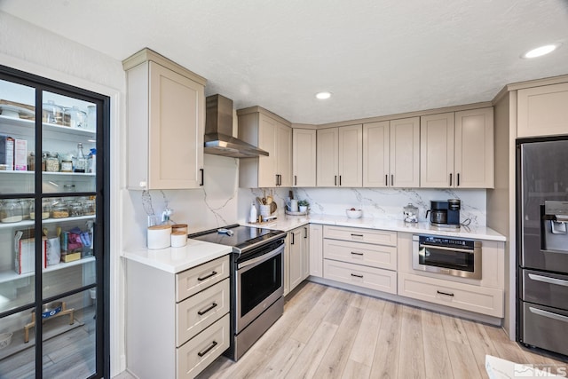 3055 US Highway 395, Washoe Valley, NV 89704 - kitchen featuring stainless steel appliances, wall chimney exhaust hood, light countertops, light wood finished floors, and recessed lighting