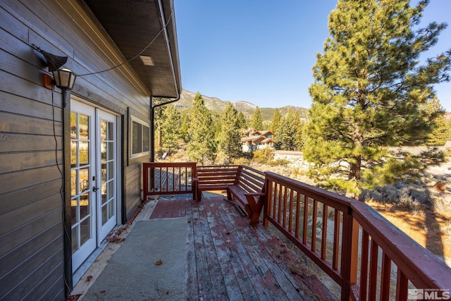 3055 US Highway 395, Washoe Valley, NV 89704 - wooden deck with french doors and a mountain view