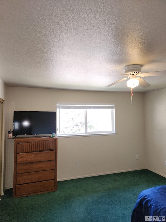 1363 Waterloo Ln, Gardnerville, NV 89410 - empty room featuring healthy amount of natural light, carpet floors, a ceiling fan, and a textured ceiling