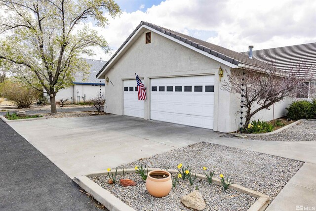 4635 Country River Dr, Fallon, NV 89406 - view of home's exterior with stucco siding and an attached garage