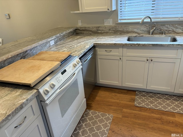 453 Mcfaul Unit 13, Zephyr Cove, NV 89448 - kitchen with white electric stove, a sink, dishwasher, wood finished floors, and white cabinetry