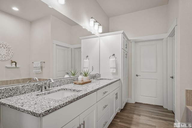 1046 Savona Ct, Dayton, NV 89403 - bathroom with wood finished floors, double vanity, and recessed lighting