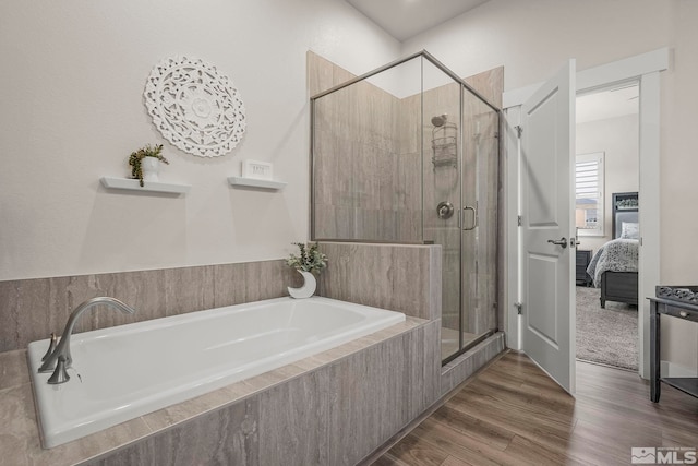 1046 Savona Ct, Dayton, NV 89403 - ensuite bathroom with a stall shower, wood finished floors, and a garden tub