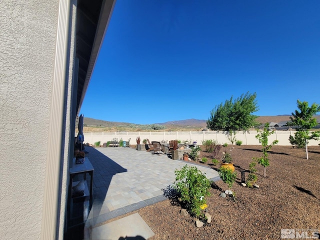 1046 Savona Ct, Dayton, NV 89403 - view of patio featuring a mountain view and a fenced backyard