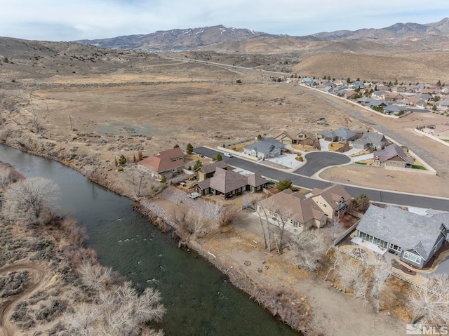 1046 Savona Ct, Dayton, NV 89403 - aerial overview of property's location with a mountain backdrop and nearby suburban area