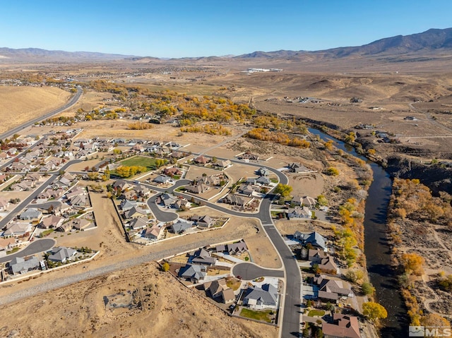 1046 Savona Ct, Dayton, NV 89403 - aerial overview of property's location featuring a mountain backdrop, nearby suburban area, and a desert landscape