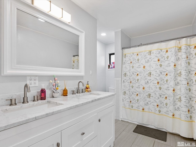 1879 Kings Canyon Rd, Carson City, NV 89703 - bathroom with double vanity and crown molding