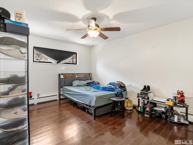1879 Kings Canyon Rd, Carson City, NV 89703 - bedroom with wood finished floors, baseboard heating, a ceiling fan, and a baseboard heating unit