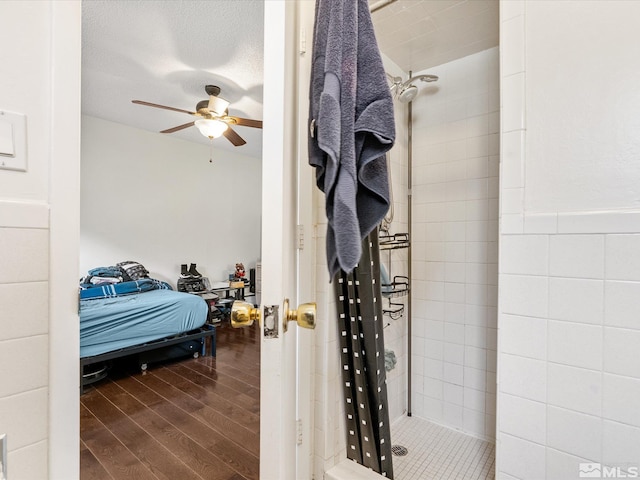 1879 Kings Canyon Rd, Carson City, NV 89703 - full bath featuring tiled shower, ceiling fan, wood finished floors, and ensuite bath