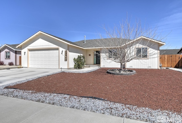 756 Megan Way, Fallon, NV 89406 - ranch-style home with an attached garage, fence, concrete driveway, and a shingled roof
