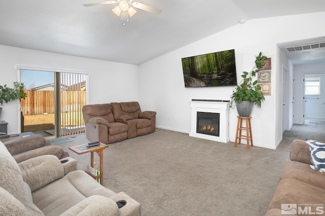 756 Megan Way, Fallon, NV 89406 - carpeted living area featuring a ceiling fan, vaulted ceiling, baseboards, and a glass covered fireplace