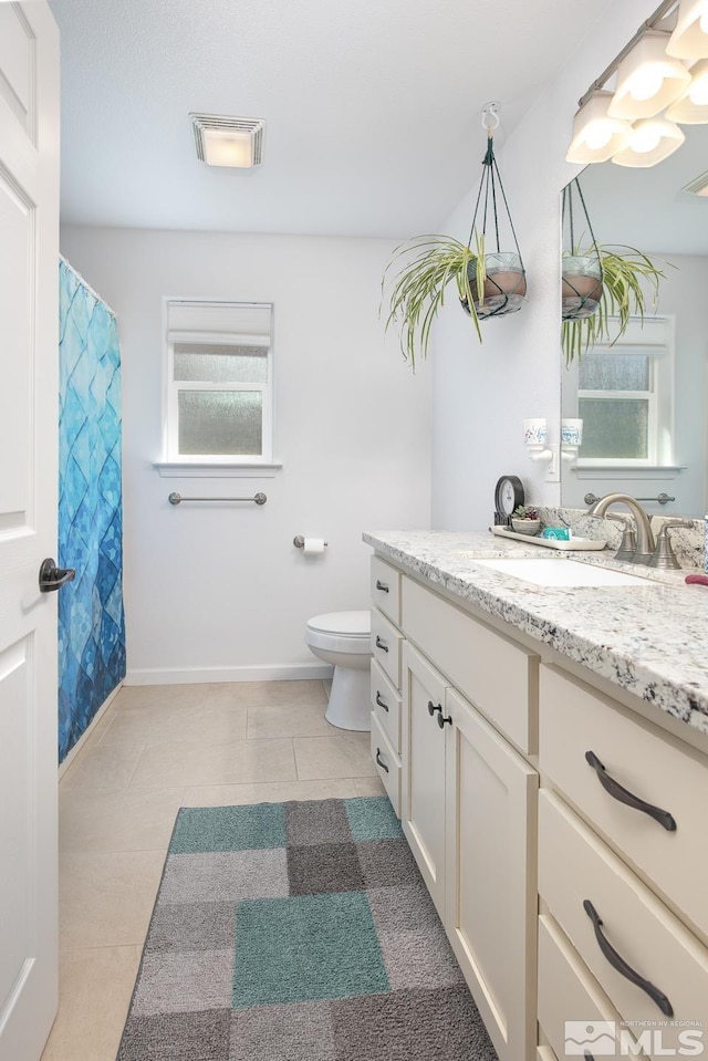 756 Megan Way, Fallon, NV 89406 - full bath featuring vanity, toilet, tile patterned flooring, and baseboards
