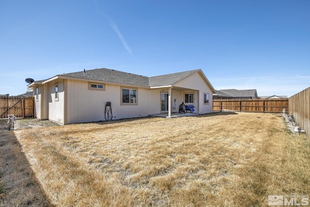 756 Megan Way, Fallon, NV 89406 - back of house featuring a fenced backyard and a patio area