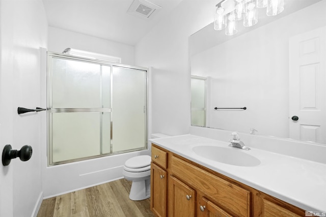 604 Venturacci Ln, Fallon, NV 89406 - bathroom featuring wood finished floors, toilet, vanity, shower / bath combination with glass door, and a chandelier