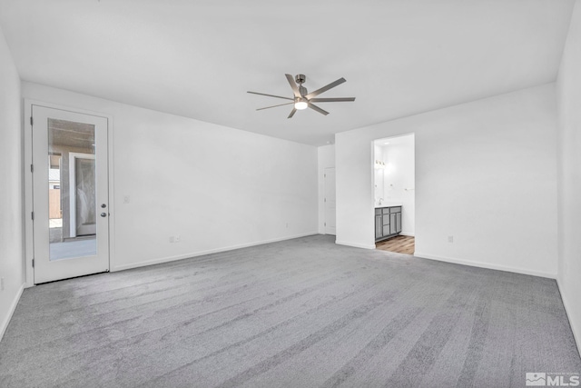 6772 Shell Ct Lot 49, Fernley, NV 89408 - unfurnished living room featuring carpet floors, ceiling fan, and baseboards