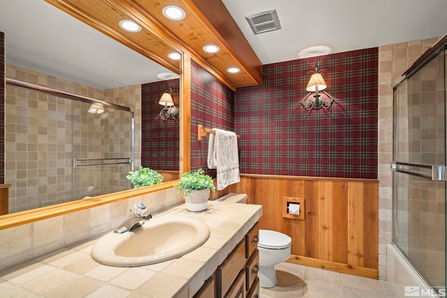 929 Northwood Unit 68, Incline Village, NV 89451 - full bathroom with toilet, recessed lighting, vanity, bath / shower combo with glass door, and tile walls