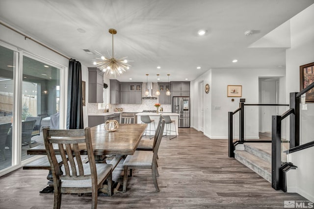 2181 Wyaconda Dr, Sparks, NV 89436 - dining area with dark wood-style flooring, stairway, a chandelier, baseboards, and recessed lighting