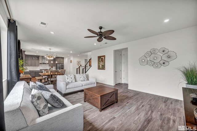 2181 Wyaconda Dr, Sparks, NV 89436 - living area with stairway, wood finished floors, recessed lighting, ceiling fan, and baseboards
