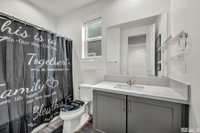2181 Wyaconda Dr, Sparks, NV 89436 - full bathroom featuring wood finished floors, toilet, vanity, and a shower with curtain