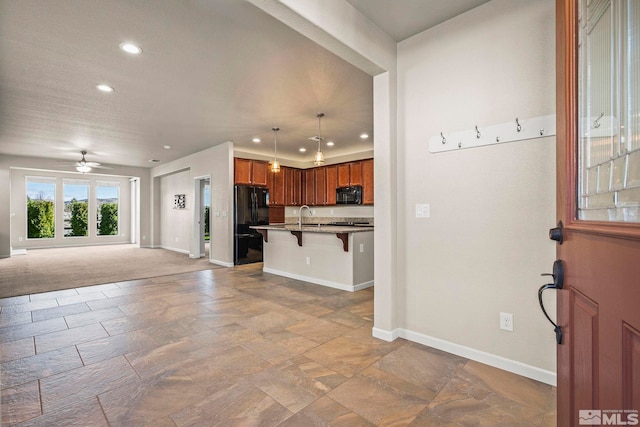 foyer entrance with recessed lighting, baseboards, stone tile flooring, and ceiling fan