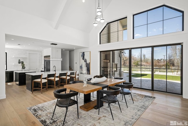 4060 Goodsell Ln, Reno, NV 89523 - dining area featuring high vaulted ceiling, light wood finished floors, and recessed lighting
